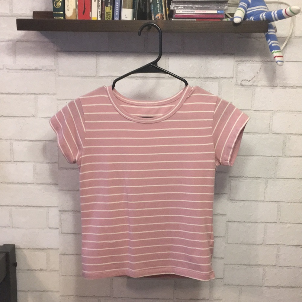 A semi cropped pink shirt.